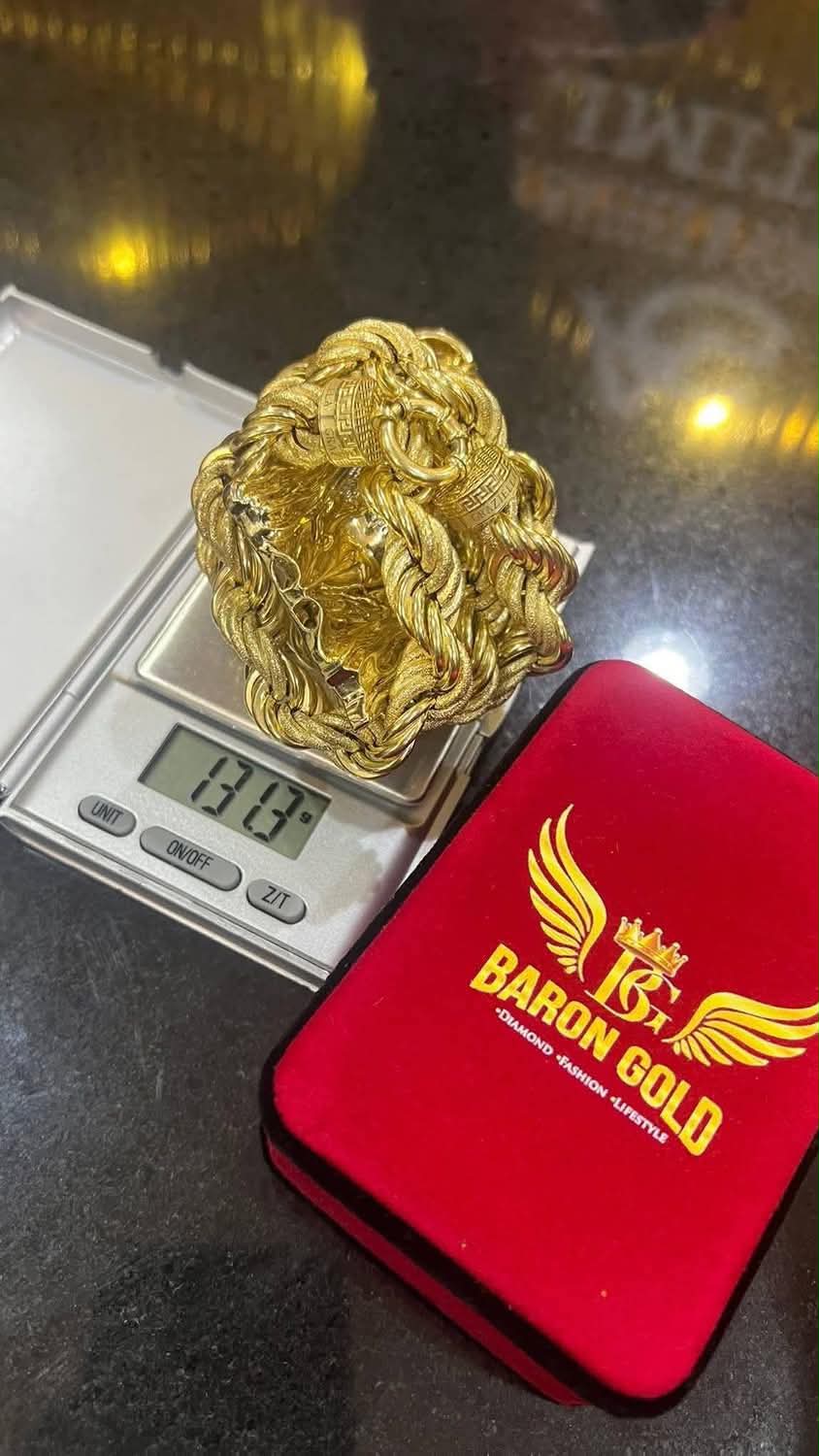 Gold weighed beside a Baron Gold box