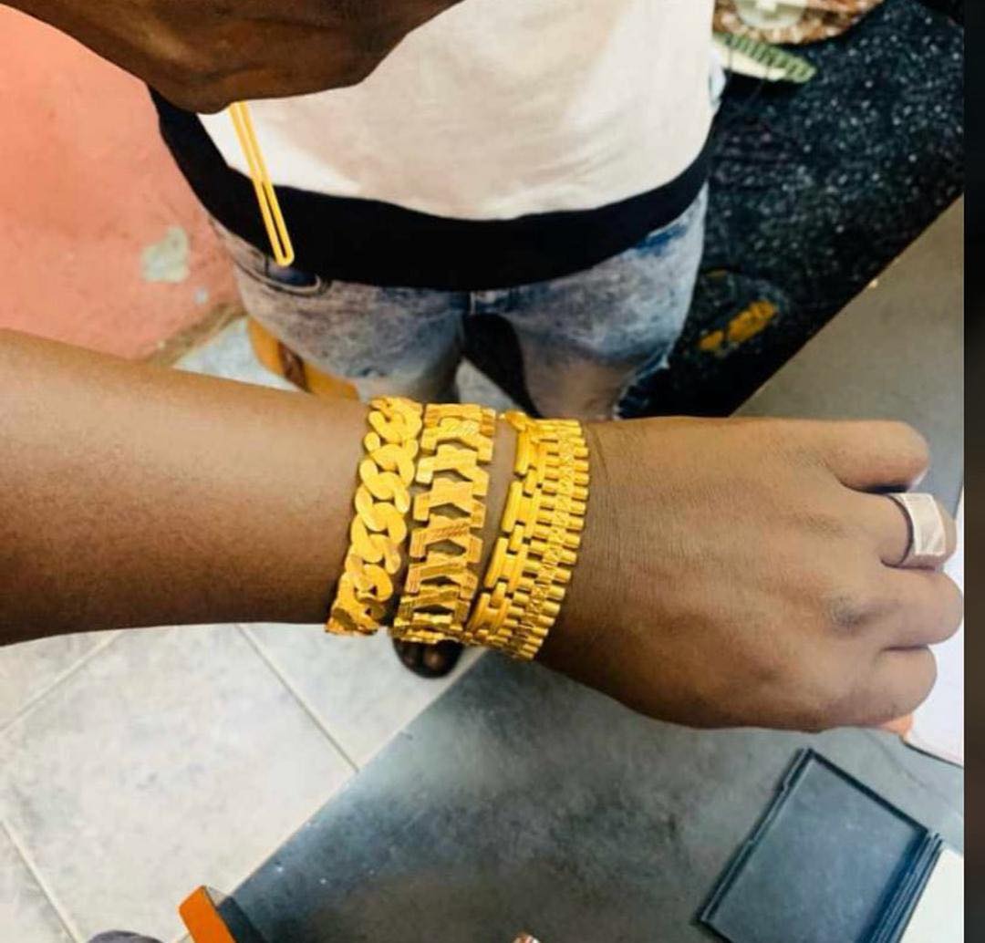 Client wearing a Baron Gold bracelet stack